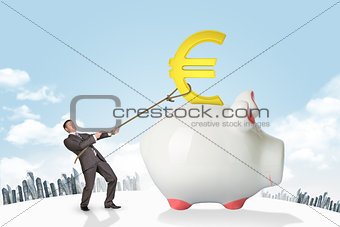 Businessman holding euro sign with rope and city
