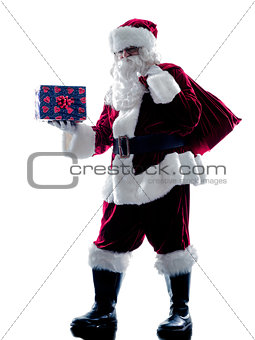 santa claus holding gifts silhouette isolated