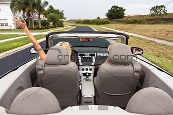 Woman Driving Convertible or Cabriolet Car 