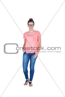 Happy pretty casual brunette looking at camera with hand on pocket