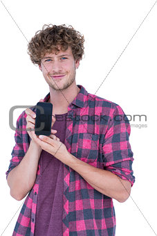 Happy handsome man showing his smartphone
