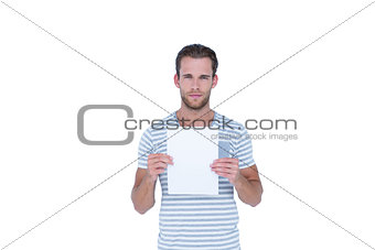 Serious handsome man holding paper