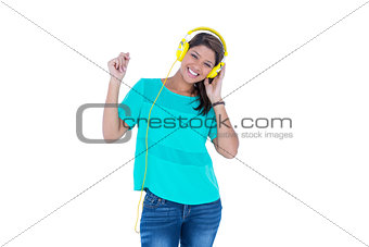Happy pretty brunette listening music