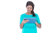 Happy pretty brunette using tablet computer
