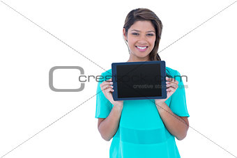 Pretty brunette showing tablet computer
