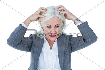 image of stressed businesswoman with hands on her head