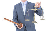 businessman holding scales of justice
