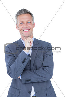 Businessman thinking with hand on chin