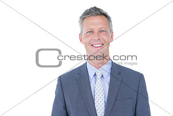 Smiling businessman against a white background