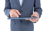 Close up view of businessman using tablet computer
