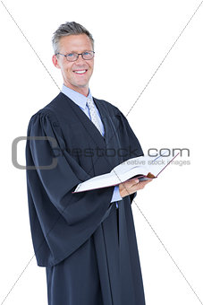 Happy handsome lawyer holding labor code