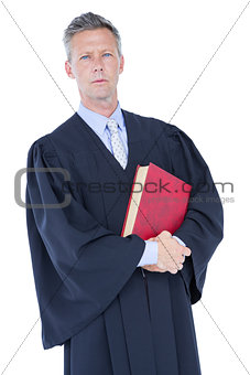 handsome lawyer holding labor code