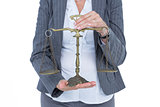 businesswoman holding scales of justice