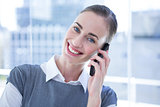 Smiling businesswomen talking on the phone
