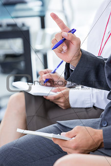 Businessman taking note during a meeting