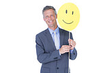 Businessman with happy smiley faced balloon