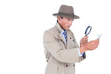 Spy looking through magnifier