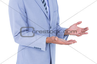 Handsome businessman gesturing with hands