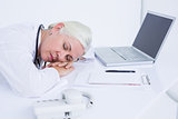 doctor sleeping on her desk
