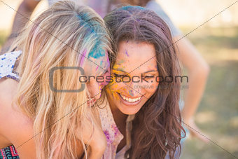 Young women having fun with powder paint