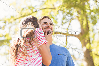 Cute couple kissing in the park