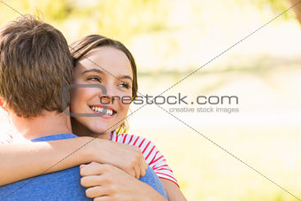 Cute couple hugging in the park