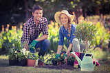 Happy young couple gardening together