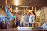 Creative business team waving their hands