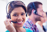 Pretty smiling businesswoman working in a call centre