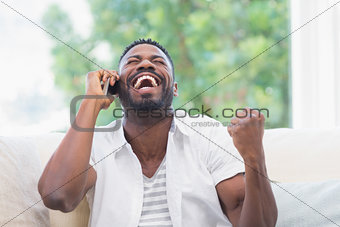 Excited man on the phone