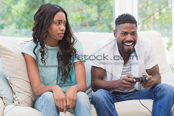 Upset woman being ignored by partner