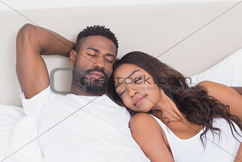 Happy couple on the bed sleeping