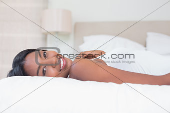 Relaxed woman lying on bed