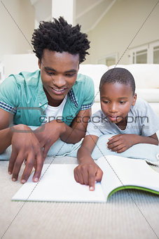 Father and son reading on the floor