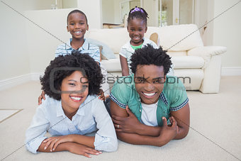 Happy family lying on the floor