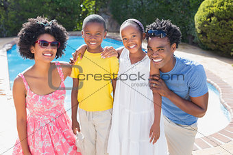 Happy family smiling at camera