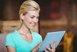 Pretty blonde using tablet computer
