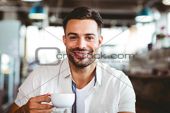 Handsome man having a coffee