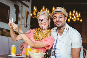 Cute couple on a date taking a selfie