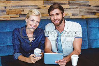 Cute couple on a date looking at the camera