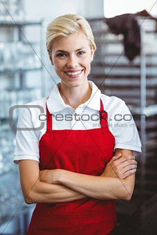Pretty barista smiling at the camera