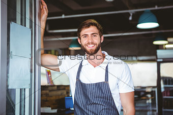 Smiling server in apron