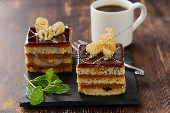 portioned dessert piece of cake with cream and chocolate
