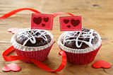 Festive pastry for Valentine's Day, chocolate muffin with red hearts