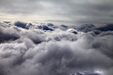 Top of off-piste slope in storm clouds