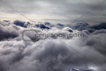 Top of off-piste slope in storm clouds