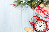 Christmas gift box, alarm clock and tree branch