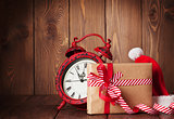 Christmas gift box, alarm clock and santa hat