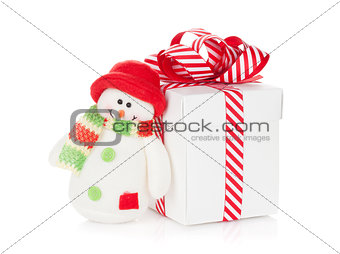 Christmas gift box and snowman toy