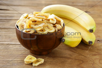 banana chips, dried fruit on a wooden table